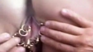 Heavy pierced MILF with 15 pierced pussy rings